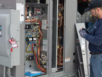 Fagan technician servicing HVAC equipment